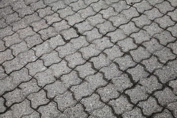 Background texture of gray urban cobblestone road