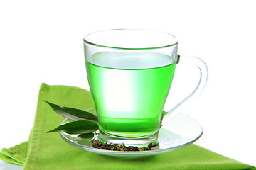 Transparent cup of green tea on napkin, isolated on white