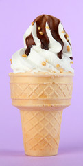 Tasty ice cream with chocolate, on purple background