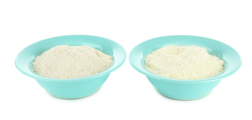 Powdered milk in bowls for baby isolated on white