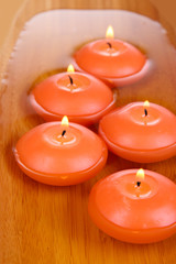 Beautiful candles in water close-up