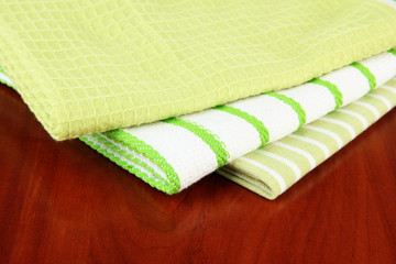 Kitchen towels on wooden background