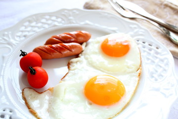 Sunny side up and sausage for gourmet breakfast image