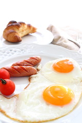 Sunny side up and sausage for gourmet breakfast image