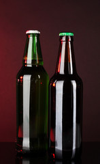 Bottles of beer on brown background