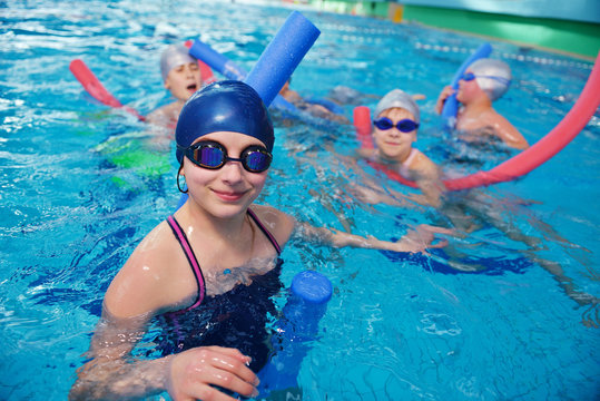happy children group  at swimming pool