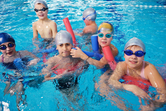 happy children group  at swimming pool