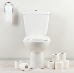 White toilet bowl with toilet paper in a bathroom