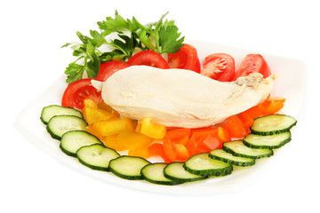 Boiled chicken breast on plate with vegetables isolated on