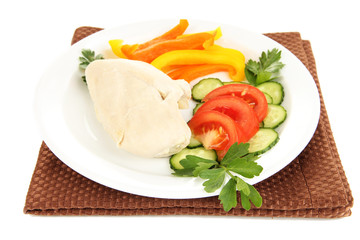 Boiled chicken breast on plate with vegetables isolated on