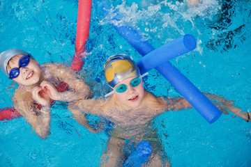 happy children group  at swimming pool