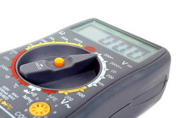 Modern digital multimeter on a white background