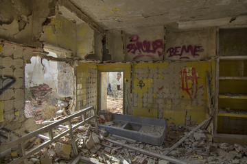 house destroyed by an explosion full of debris