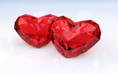 Two ruby hearts on white background