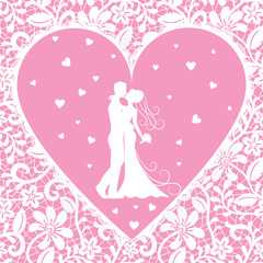 Fototapeta na wymiar kissing groom and bride on lace background