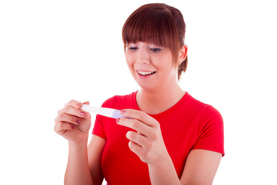 Die junge Frau mit dem Schwangerschaftstest