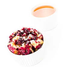 Fresh Blueberry crumble dessert in a bowl with a cup of tea  on