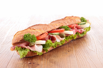 sandwich with ham,lettuce,cucumber and tomato