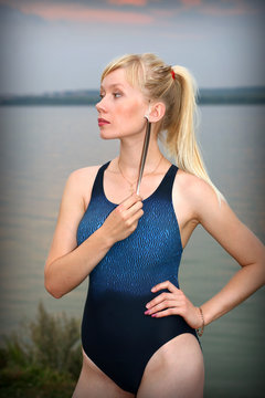 Young girl in athletic swimsuit