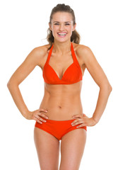 Fototapeta premium Portrait of smiling young woman in swimsuit