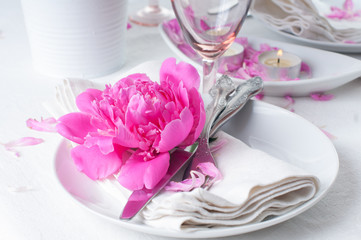 festive table setting with pink peonies