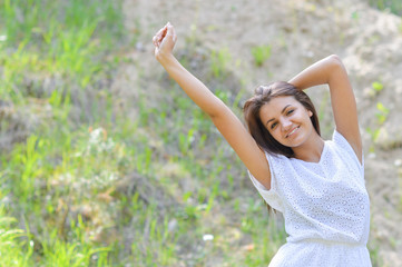 Woman in wheat field enjoying, freedom concept