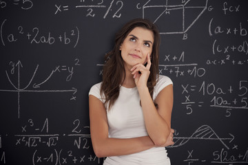 Female student thinking about mathematics problem