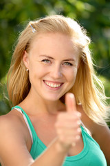 beautiful woman showing thumbs up gesture