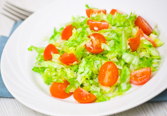 Fresh vegetable salad with cherry tomatoes and cabbage