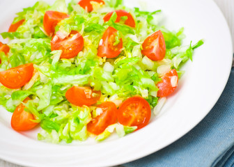 Fresh vegetable salad with cherry tomatoes and cabbage