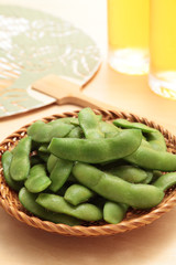 Green soybeans in the pod and beer