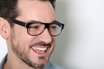 Obraz premium Portrait of cheerful man with eyeglasses on