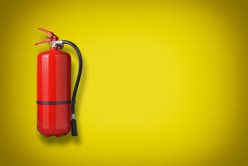 Fire extinguisher on the yellow wall