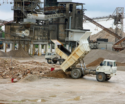 huge truck with tipper in a open pit mine in an industrial area