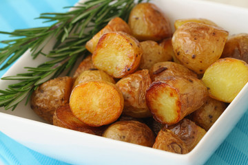 Roasted baby potatoes with fresh rosemary, close up