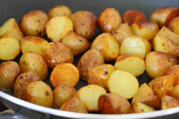 Baby potatoes on frying pan