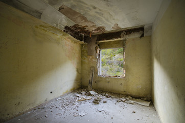 inside of  a Spooky abandoned room with a window