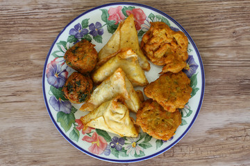 Selection of Indian vegetarian starters on vintage plate