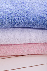 blue white and pink towel in bath