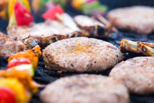 Barbecue with hamburgers and skewers