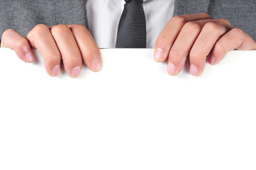 Obraz premium man in suit holding a blank signboard