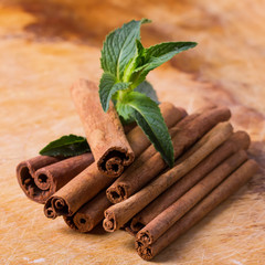 Cinnamon on wooden background