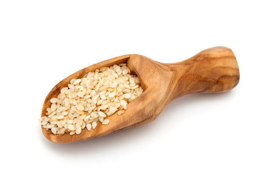 sesame seeds in a wooden scoop