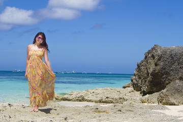 young beautiful happy woman on tropical beach and sea background