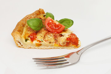 Quiche and fork on a plate