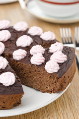 chocolate cake with nuts cut into slices closeup