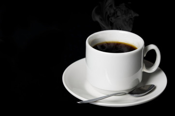 cup of coffee on a black background closeup