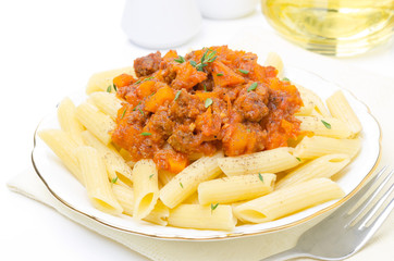 penne pasta with sauce of beef, tomato, pumpkin on the plate