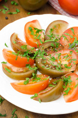 salad of two varieties of tomatoes with fresh parsley, vertical
