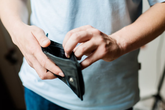 Man and empty wallet